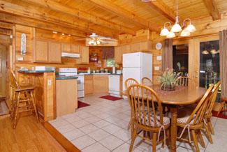 Pigeon Forge Cabin that features a kitchen and seating area